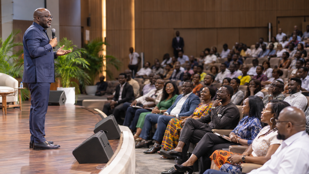 Ghanaian executive speaking at an employee town hall.